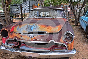 Red old abandoned Desoto car