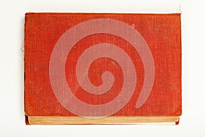 Red old hardback book on white background