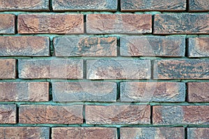 red old brick wall background, brick wall texture, structure. old broken brick, cement joints, close-up.