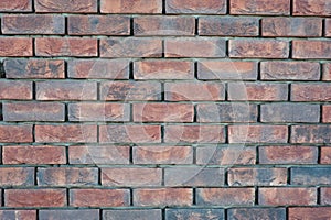red old brick wall background, brick wall texture, structure. old broken brick, cement joints, close-up.