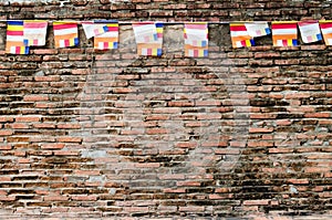 Red old Brick Wall with Colorful Flags