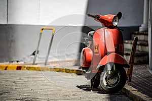 Red old fashioned moped