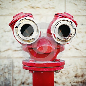 Red old fire hydrant on a street