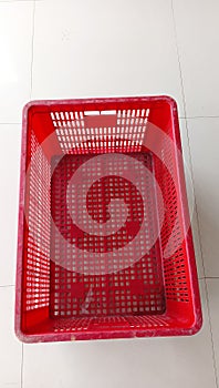 a red old industrial basket for multipurpose storage