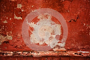 Red old wall. abstract background texture concrete wall. Paint peels from the surface of the wall.