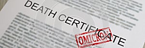 Red omicron seal standing on death certificate document closeup