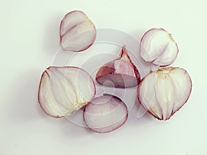 Red onion bulb slice on white background
