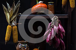 Red onion, corn cobs and a pumpkin