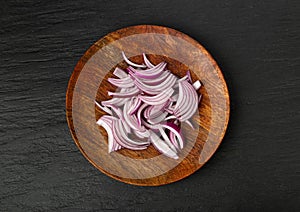 Red Onion Cuts on Wood Plate, Raw Purple Onion Slices, Chopped Purple Onion Pieces on Black