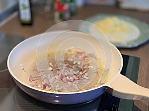 Red onion fried in a pan