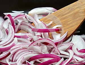 Red onion fried in a pan
