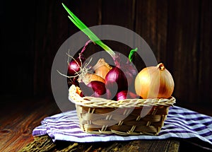 Red onion and onion in a wicker basket