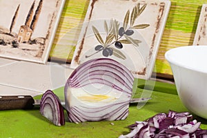 Red onion sliced on the board, knife, kitchen, cooking