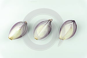 Red onion slices isolated on white background
