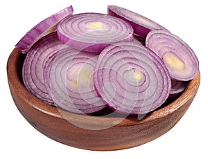 Red onion slices in a wooden bowl on a white