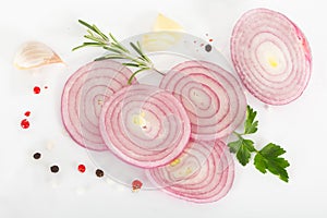 Red onion and spices on white background