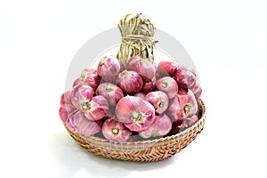 red onions in basket isolated on white