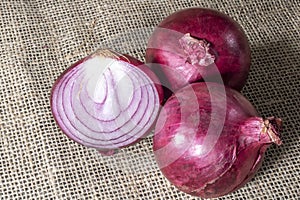 Red onions on jute background