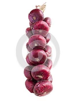 Red onions twisted in chain