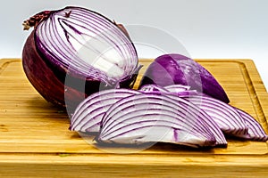 Red onions on a wooden cutting board. Calgary alberta Canada