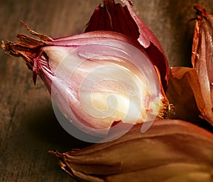 Red onions on wooden planks