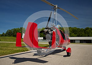 Red open-cockpit autogyro