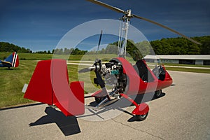 Red open-cockpit autogyro