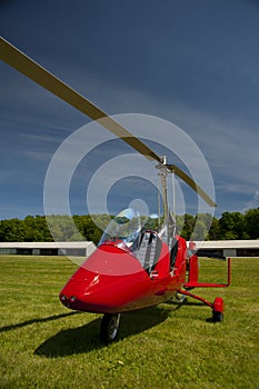 Red open-cockpit autogyro