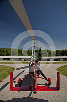 Red open-cockpit autogyro