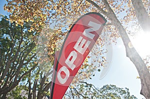 Red Open House for Sale/Rent signage in Autumn