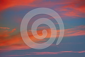 Red orange clouds in dramatic sunset sky
