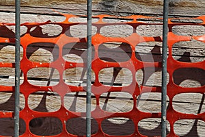 Red orange cut-out plastic barrier net. Red Plastic Barrier, Abstract Background Motvie.You shall not pass