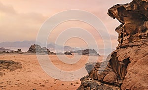 Red orange Mars like landscape in Jordan Wadi Rum desert, mountains background, overcast morning. This location was used