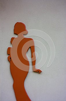 Red orange stylized female figure silhouette on white background