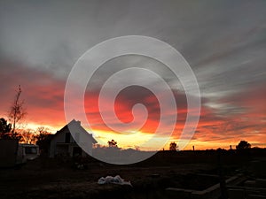 Red orange sunset over construction site in Poland