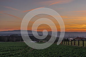 Red and orange sunset sky near Ceske Budejovice city in spring evening