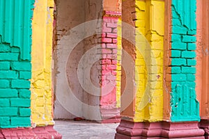 Red, Orange, yellow and blue color combination old Textured damage wall with Colorful Bricks