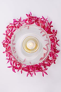 Red orchid circle with bowl and candle