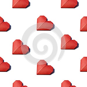 red origami heart folded from colored paper isolated on white background seamless pattern.