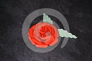 Red Origami Rose Blossom - Paper Art on Textured Background