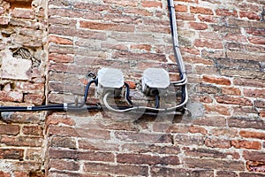 Cable electrical on outdoor wall .lectrical boxes and lots of electrical wires connecting photo