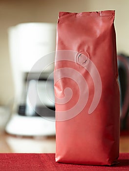 A red packet of coffee without a label