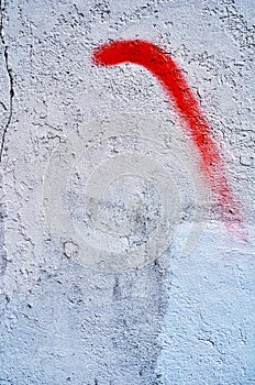 Revolt sign in red on a ruined wall of white cement photo