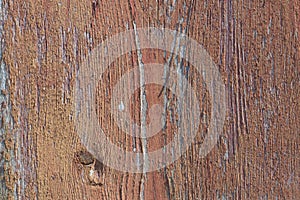 Red paint on an old vertical wooden board. Close-up. the background. copy spase