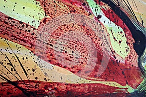 Red paint splashes. Abstract art background. Closeup shot of strokes colorful acrylic paint on canvas with brush stroke