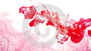 Red paint in the water abstract background. ink in fluid. colorful splashes in liquid