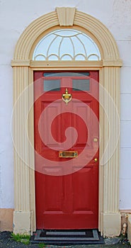 Red painted door, british house entrance