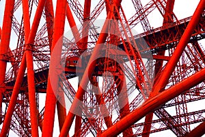 Red painted girders and struts on bridge