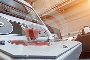 Red panic button on the dashboard of the machine control