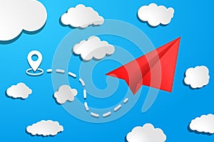 red paper airplane with start point, dah line trace and white clouds on blue air background. Clear sky travel background